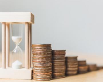 Image of coins and hour glass